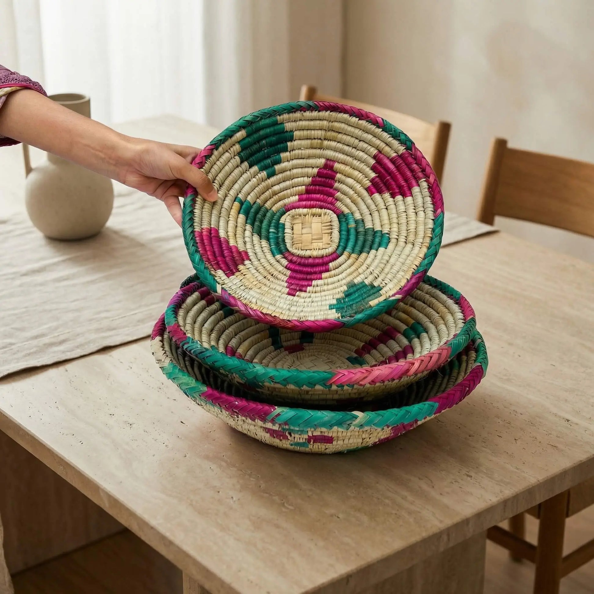 A collection of three SHKOR Mazari baskets in small, medium, and large sizes to show nesting capability.